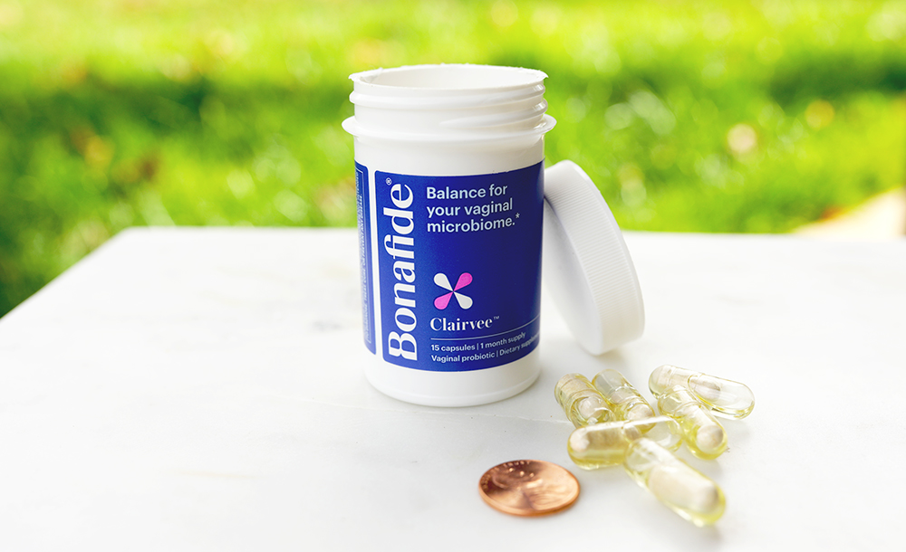 Clairvee capsules compared to a penny for scale. Photo by WellnessVerge