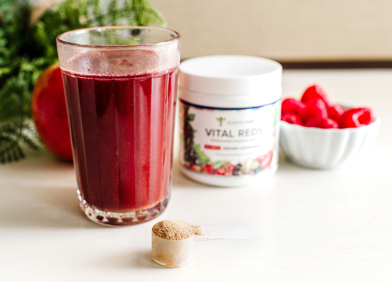 Vital Reds powder mixed with water in a glass