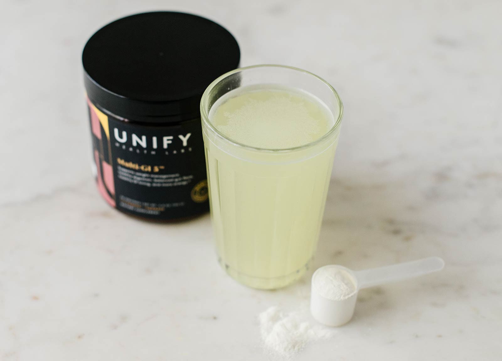 One scoop of Multi-GI 5 mixed in a glass of water
