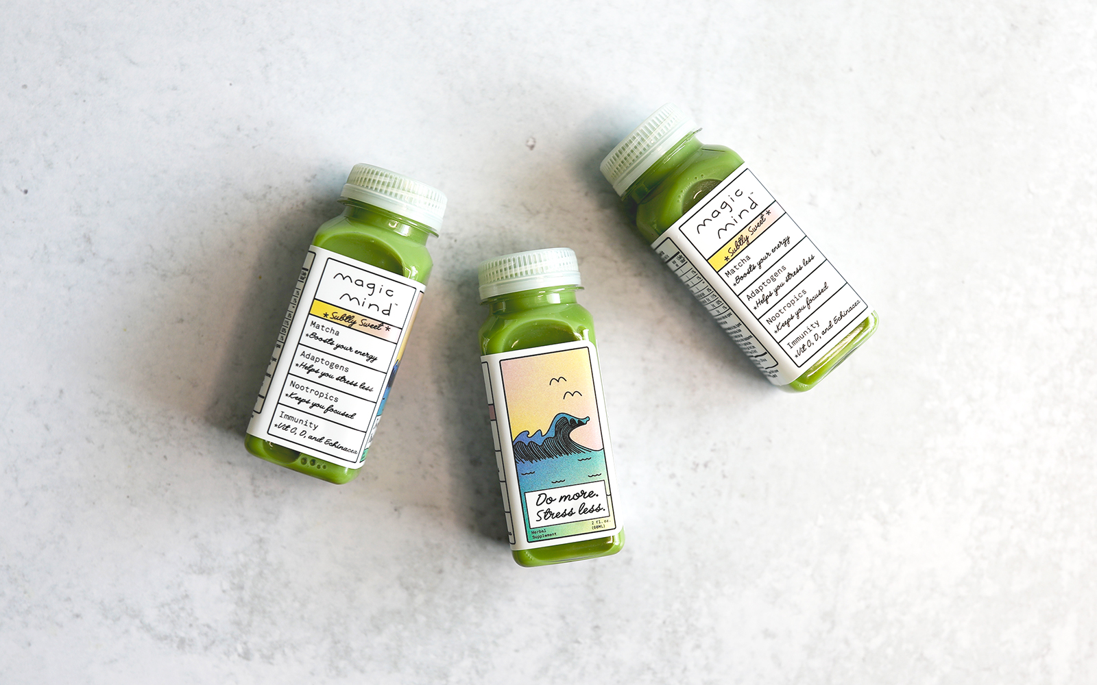 Three Magic mind bottles lying on counter